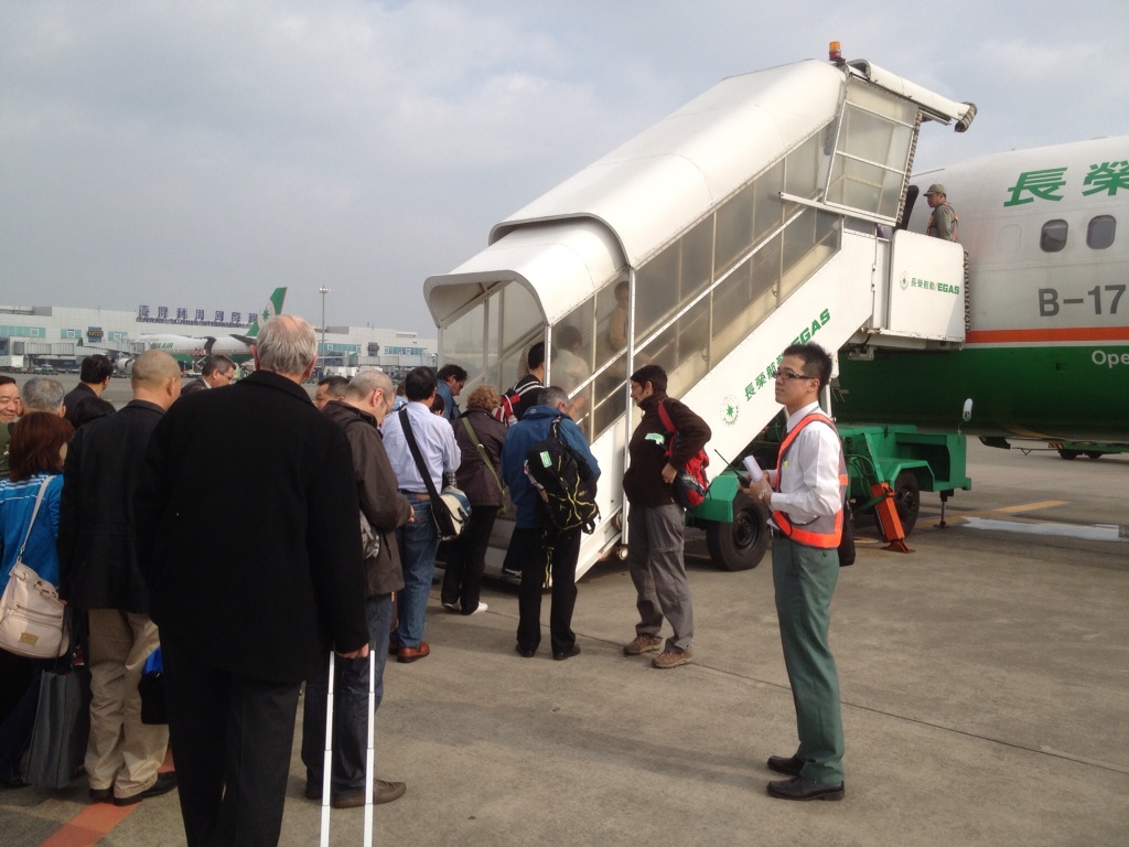 Passengers boarding airplane